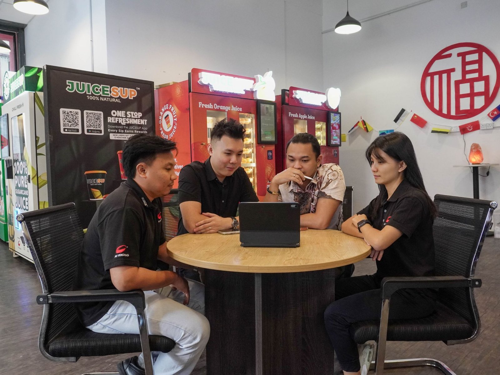 Nu Vending consultants discussing a vending plan with a client